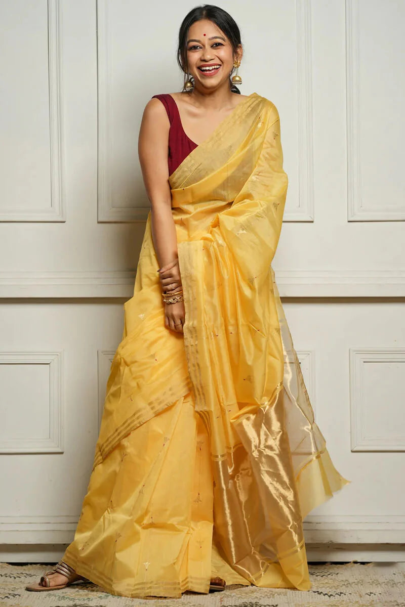 Engaging Yellow Cotton Silk Saree With Stunning Blouse Piece