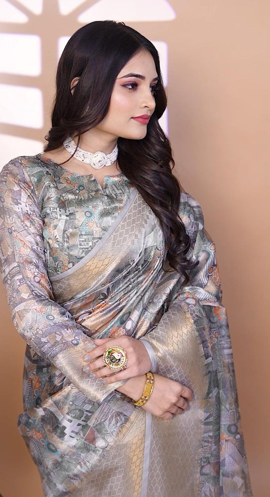 Graceful Soft Silk Saree with Ethnic Print And Zari Border