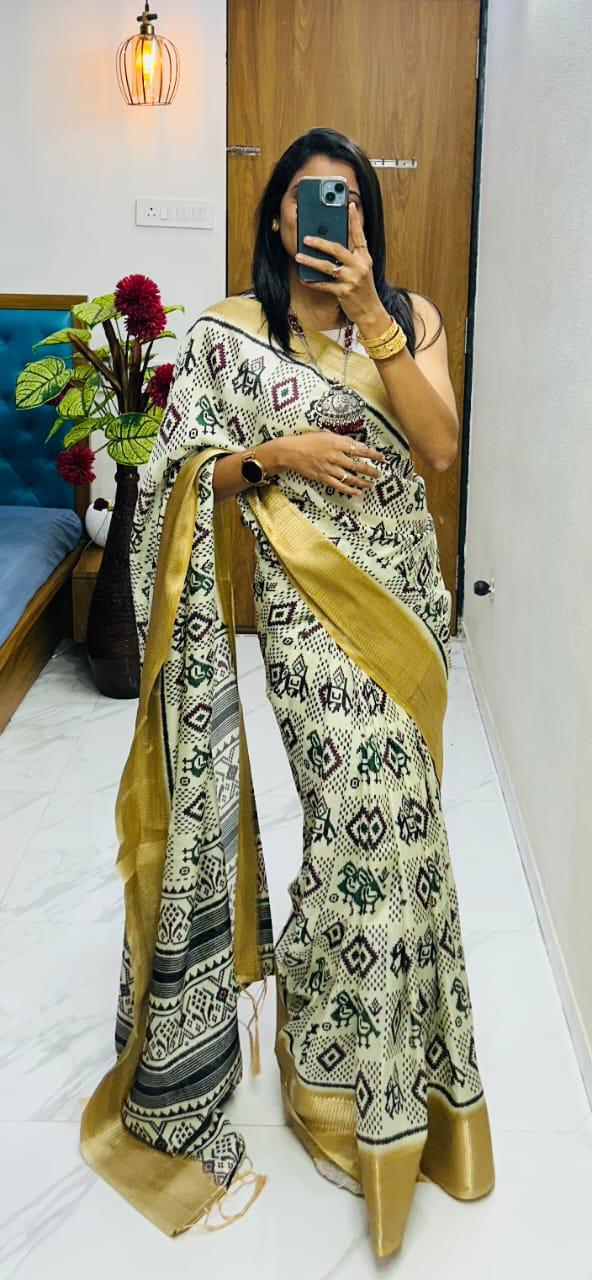 Winsome Handloom Silk Saree In Ikkat Print With Zari Border