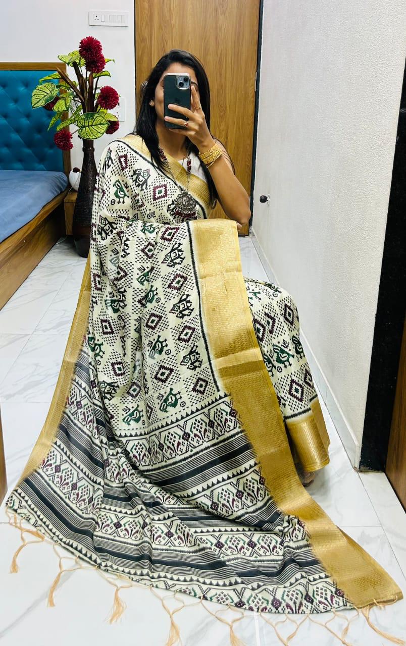 Winsome Handloom Silk Saree In Ikkat Print With Zari Border