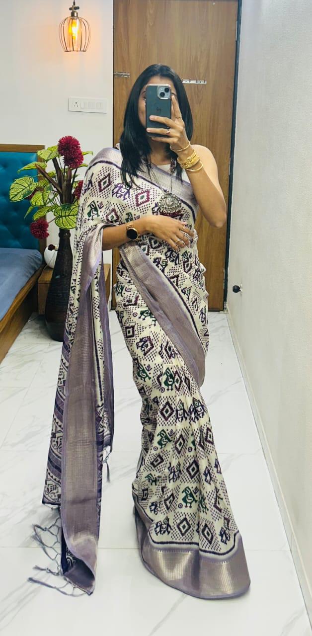 Winsome Handloom Silk Saree In Ikkat Print With Zari Border