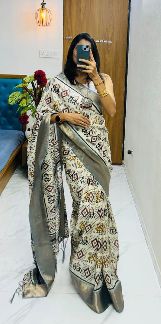 Winsome Handloom Silk Saree In Ikkat Print With Zari Border