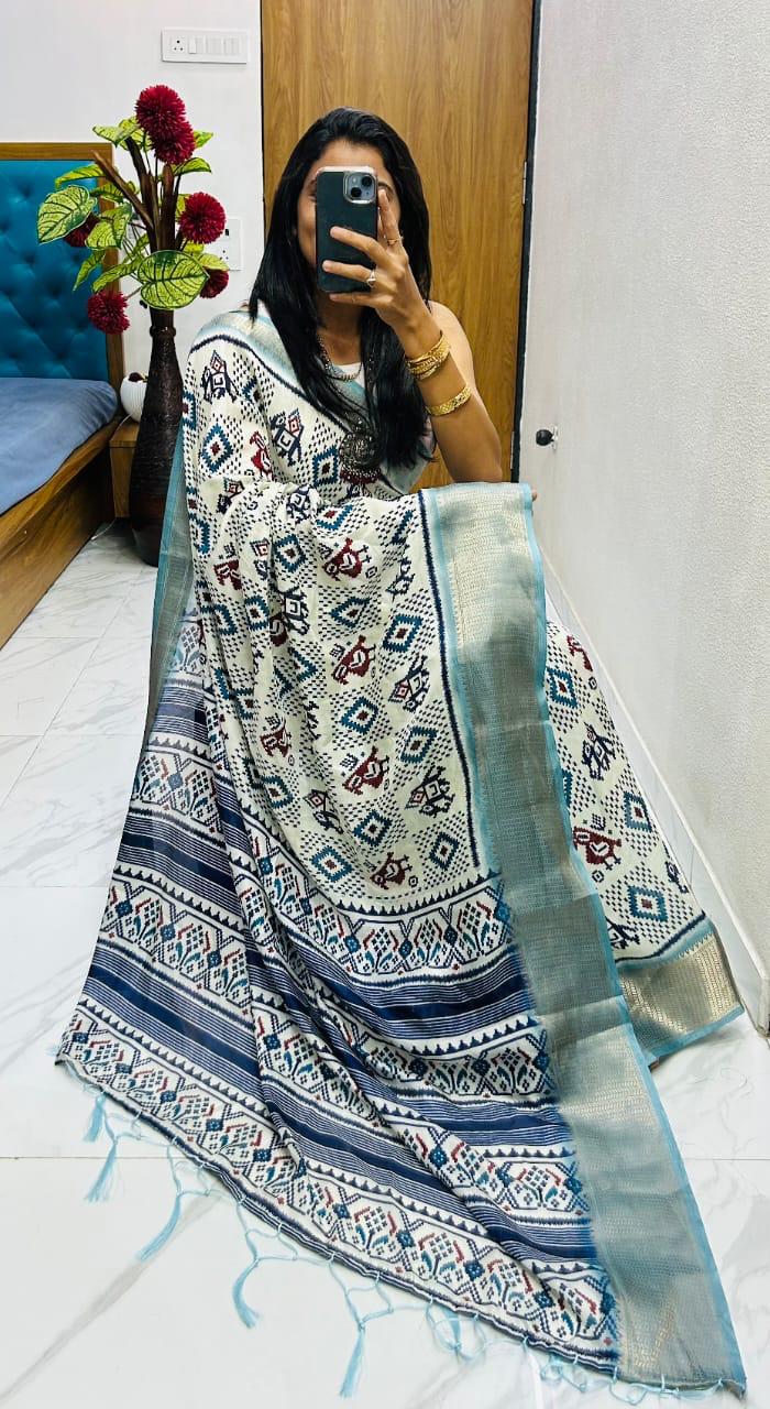 Winsome Handloom Silk Saree In Ikkat Print With Zari Border