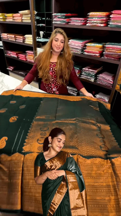 Very Engaging Dark Green Soft Banarasi Silk Saree With Gorgeous Blouse Piece