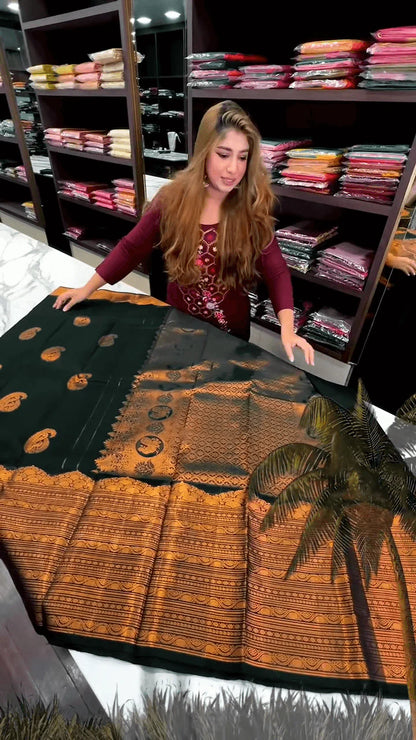 Very Engaging Dark Green Soft Banarasi Silk Saree With Gorgeous Blouse Piece