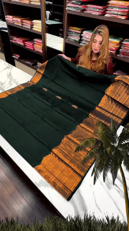 Very Engaging Dark Green Soft Banarasi Silk Saree With Gorgeous Blouse Piece