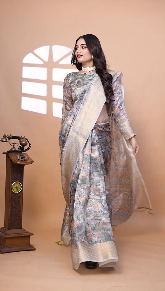 Graceful Soft Silk Saree with Ethnic Print And Zari Border
