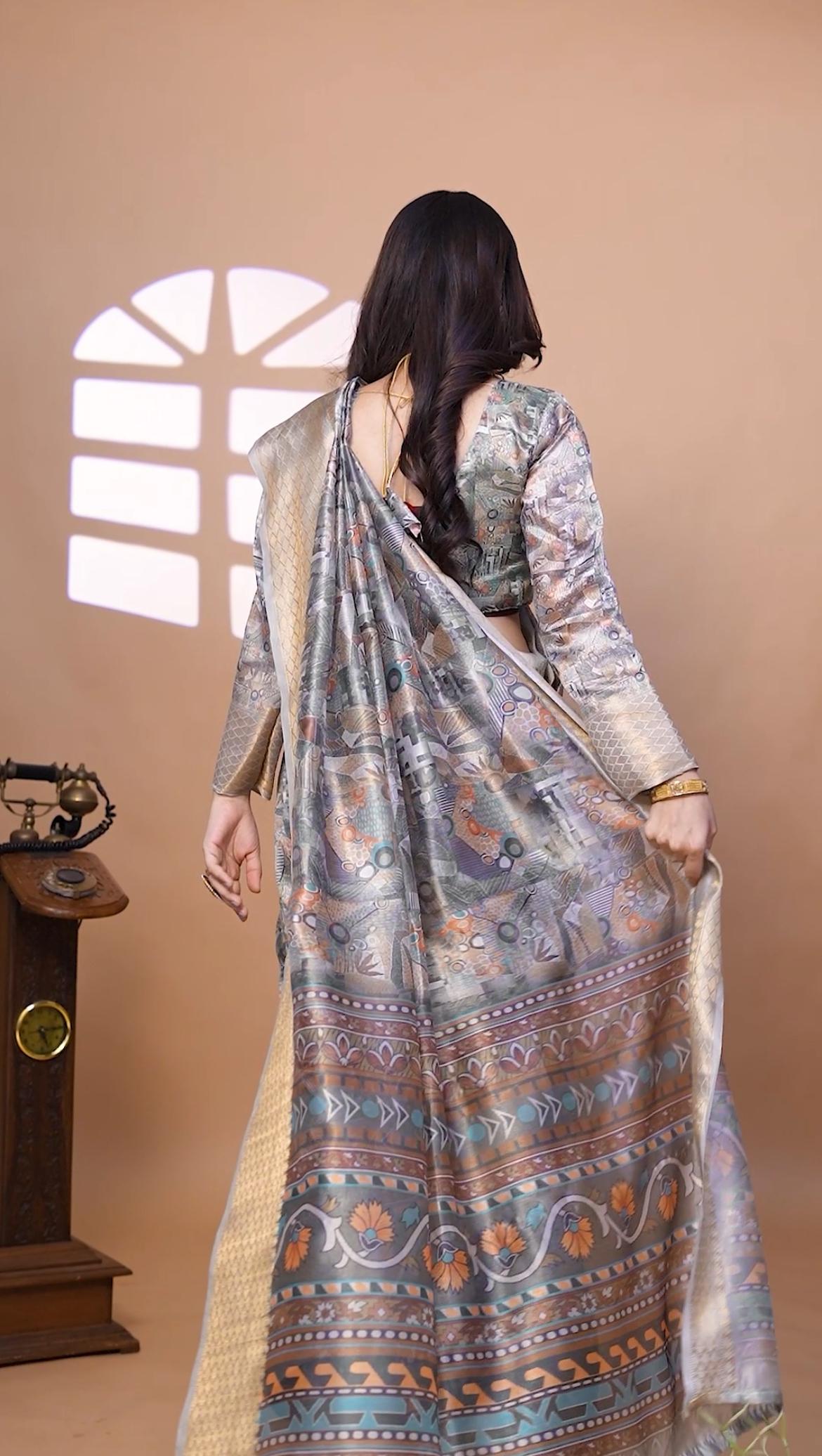 Graceful Soft Silk Saree with Ethnic Print And Zari Border